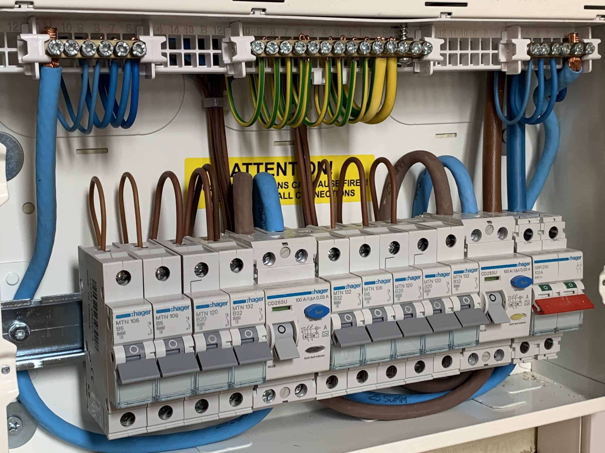 Electrician completing an EICR inspection in a London rental property